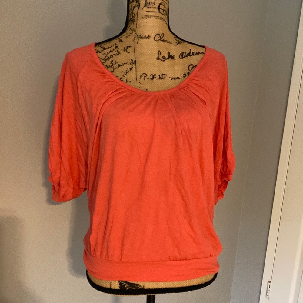 Splendid top size medium.  Persimmon color.
